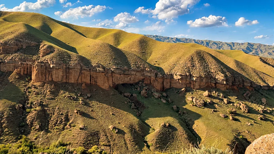 Layered terrain and panoramic views on a high-altitude plateau near Almaty
