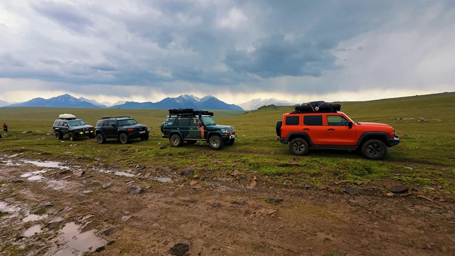 Off-road vehicles on a mountain route from Almaty to a remote plateau